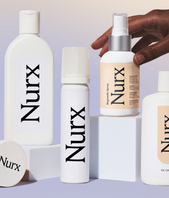 A hand arranges several Nurx-branded skincare bottles and a pill container on geometric blocks against a gradient background.