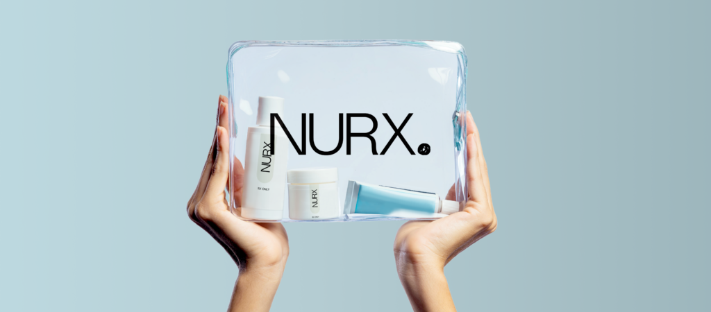 Hands holding a clear bag containing three Nurx skincare products against a light blue background.